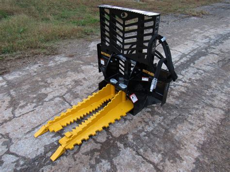 cat skid steer tree puller|intimidator vs dominator tree puller.